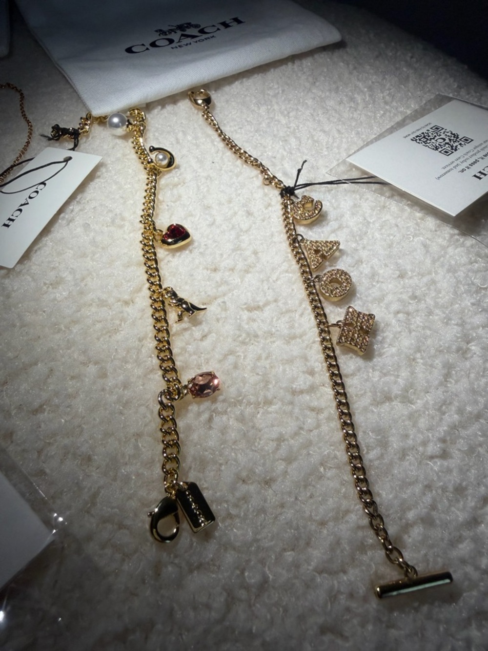 Coach Gold-Tone Multi Charm Necklace with Black and Pearl Accents